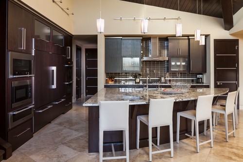 Alaskan White Granite Countertop and Island Top with Chocolate Cabinets and Brown Ceramic Subway Tiles